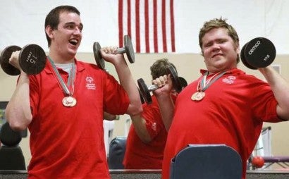 2 special olympians Weight lifting